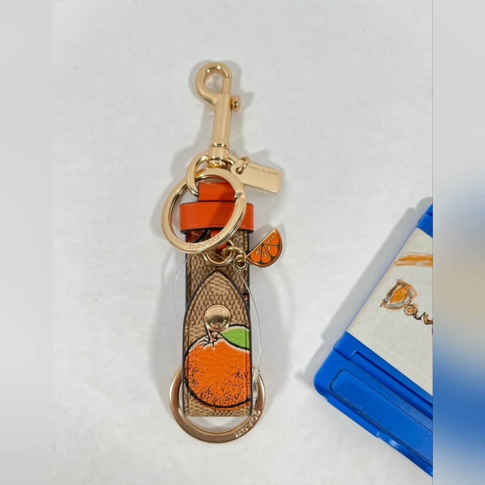 Coach Trigger Snap Bag Charm In Signature Canvas With Orange Print NWT